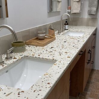 Gilasi Surfaces recycled glass countertop in Tosoro- Redrock Tileworks backsplash color Fog