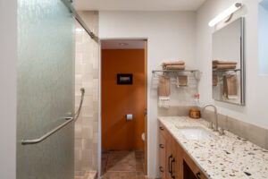 Gilasi recycled glass countertop in Tesoro and Redrock Tileworks backsplash in Fog- Photo by Logan Havens