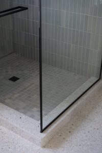 Redrock Tileworks Grey Ice and Wausau Terazzo tile flooring in Pisa- Photo by Logan Havens